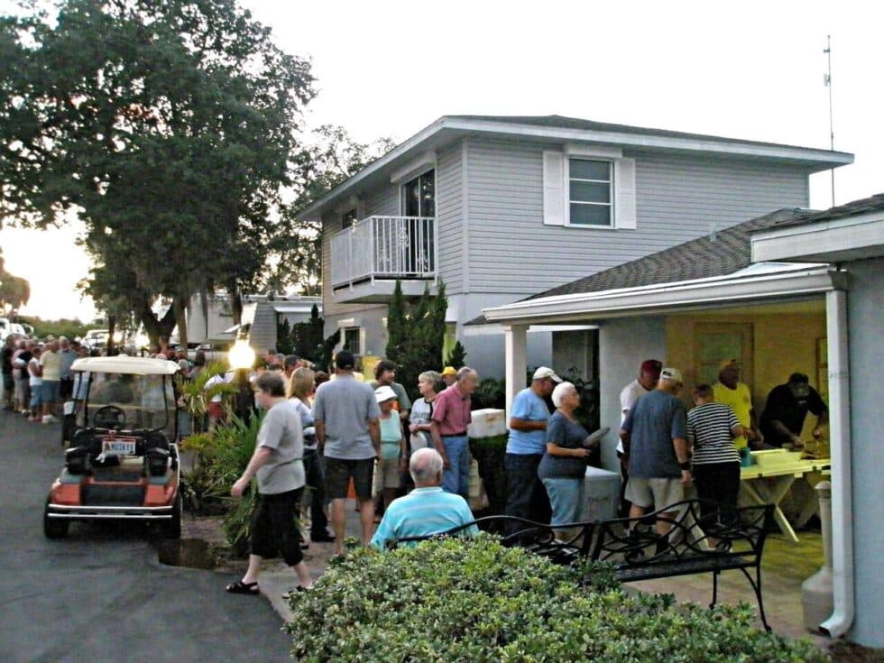 Residents lining up for a popular BBQ night outside the clubhouse at Camelot RV Park